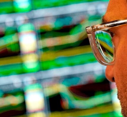 A trader works at his desk on the floor of the New York Stock Exchange